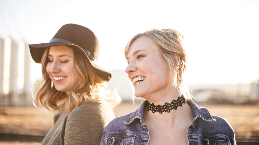 two happy and smiling women